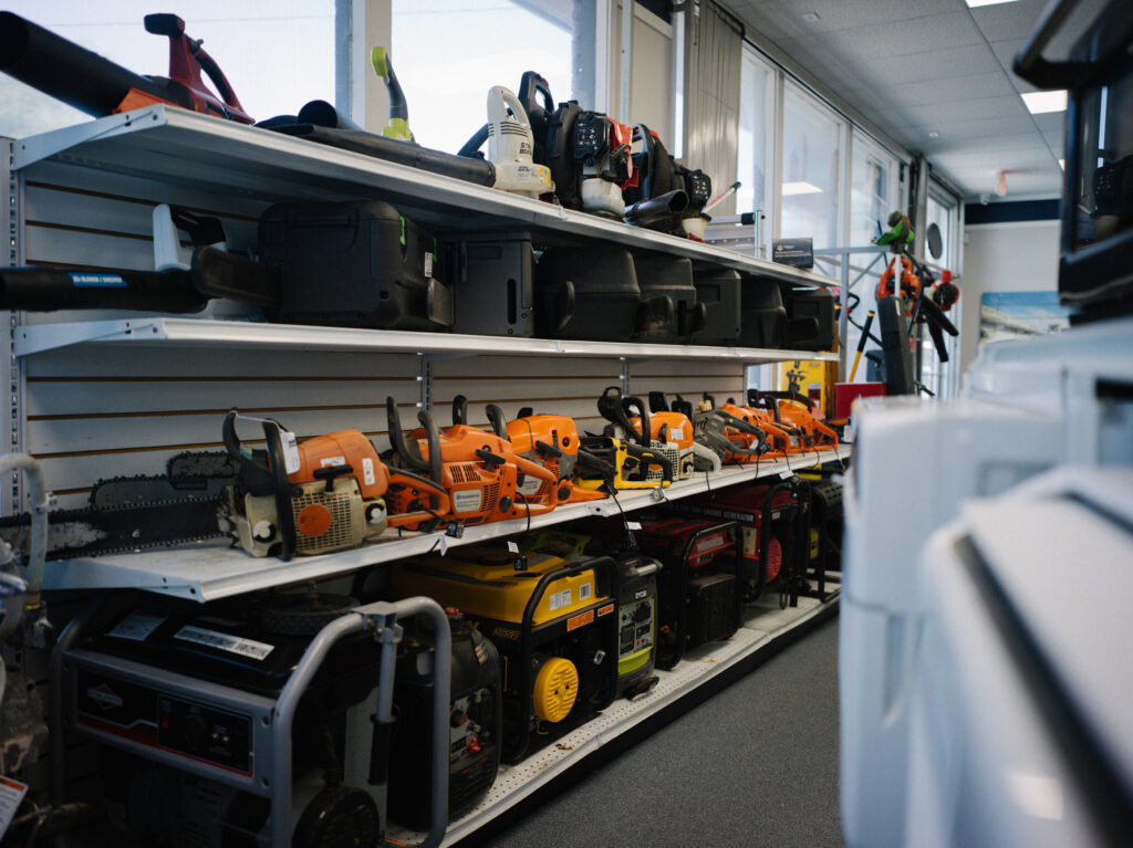 Summer equipment on shelves at Pawn 1. Leaf blowers, Chainsaws, Power Generators.
